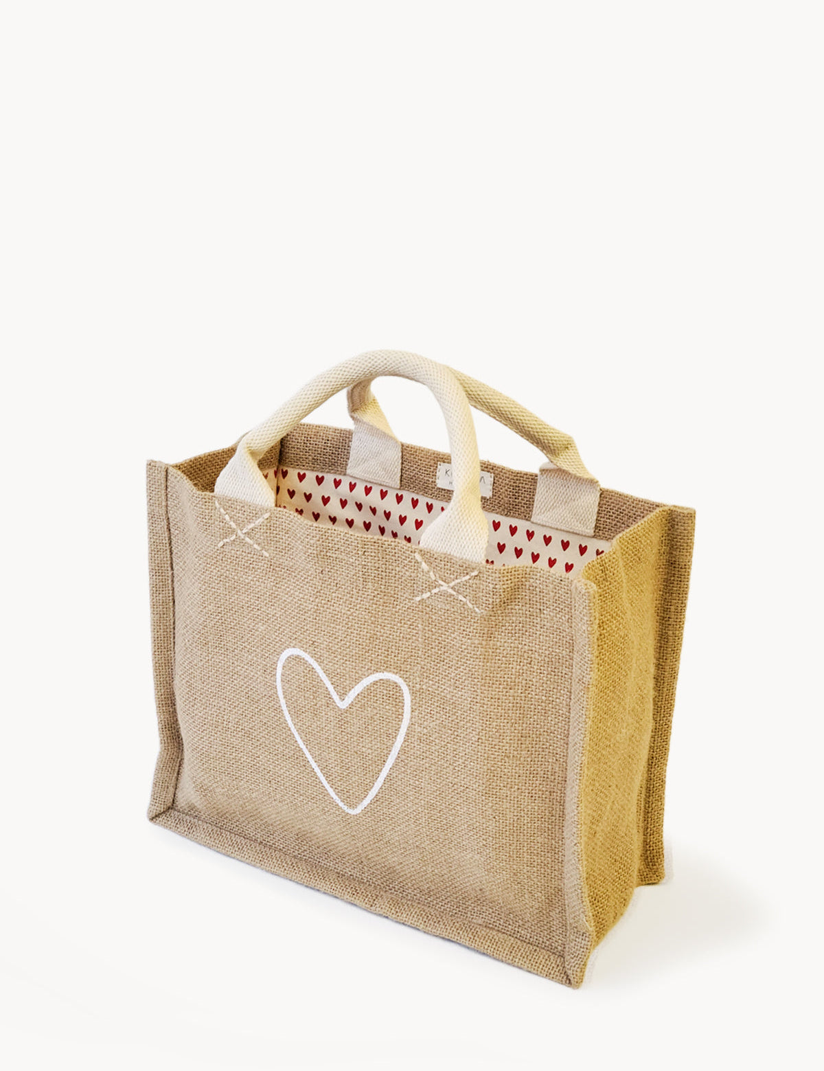 handmade tote bag. market tote. heart print lining. heart print. jute canvas material. 10” tall x 12.5” wide x 6" deep.