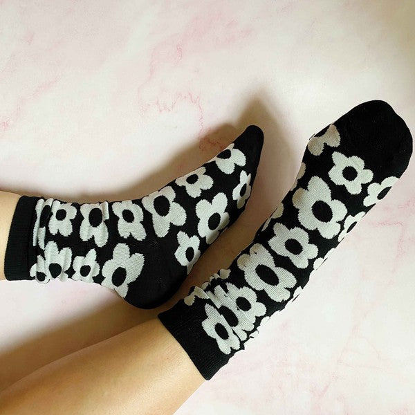 set of 2 pairs of socks. daisy  pattern.black and white.    soft, stretchy material. 