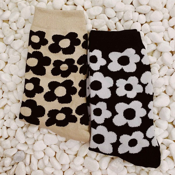 set of 2 pairs of socks. daisy  pattern.black and white.  brown and black.  soft, stretchy material. 