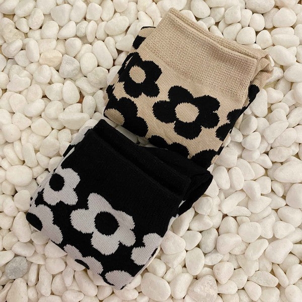 set of 2 pairs of socks. daisy  pattern.black and white.  brown and black.  soft, stretchy material. 