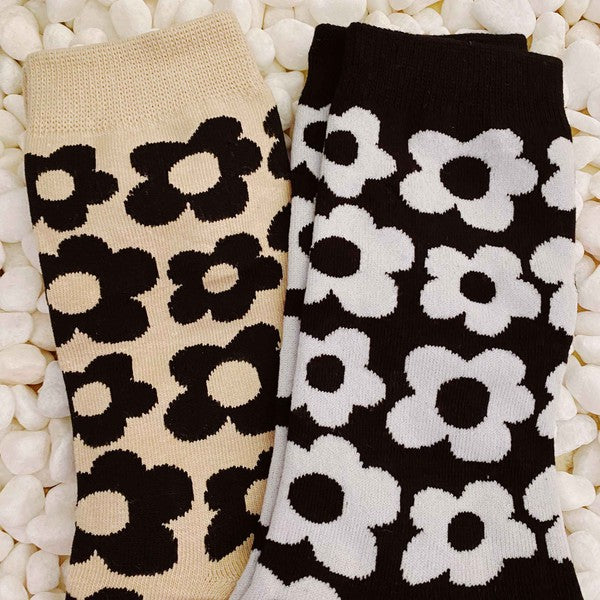 set of 2 pairs of socks. daisy  pattern.black and white.  brown and black.  soft, stretchy material. 