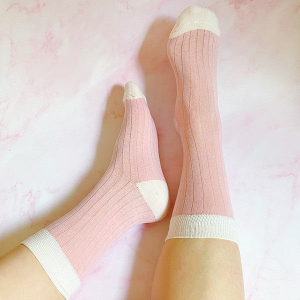 set of 2 pairs of socks. pink with white heal and toe detail.  soft, stretchy material. 