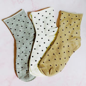 set of 3 pairs of socks. polka dot  pattern. white, gray, brown in the pack. soft, stretchy material. 