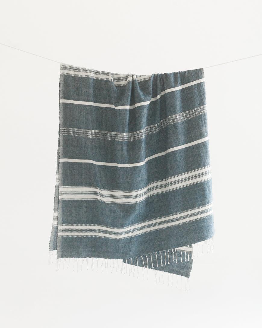 Bath Towel. Measures 38 x 72 inches. Machine wash and dry. ed as bath towels, lightweight shawls and accent throws. AZO-free dyes. hand-woven in Ethiopia. Navy with Natural. 