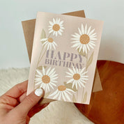 Happy Birthday Card. Hand drawn Daisy design. Birthday Card. Hand holding card with envelope. 