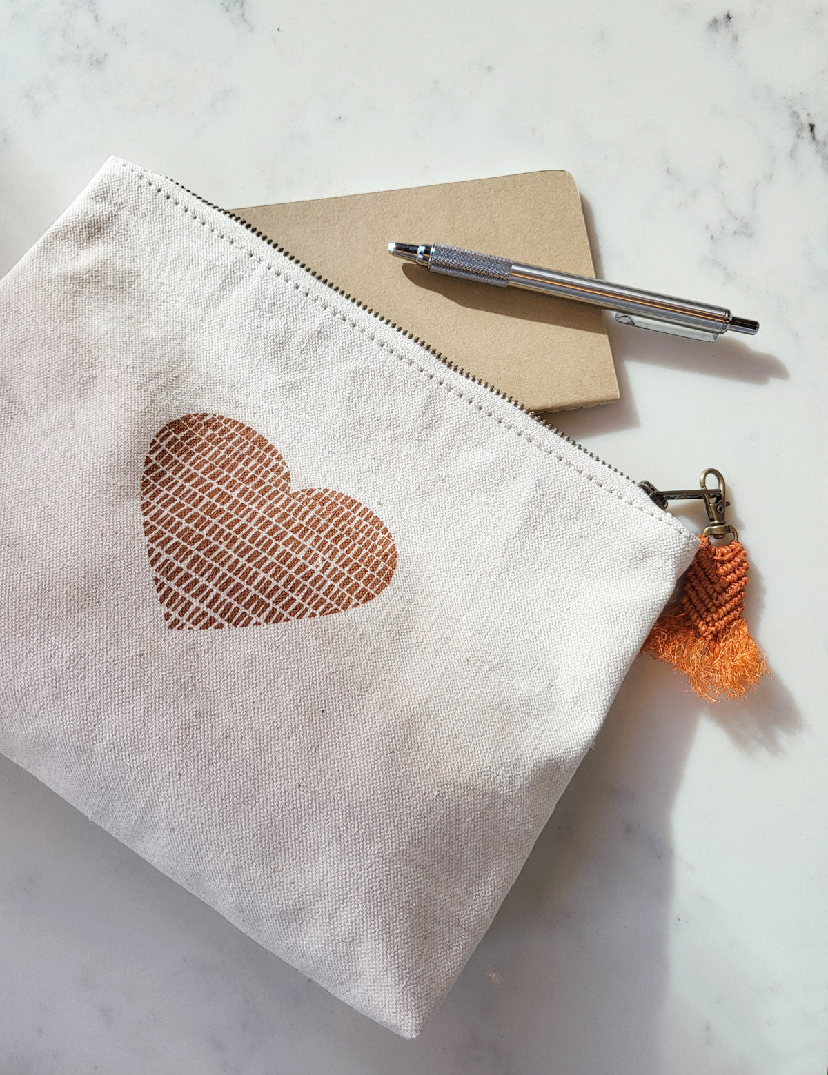 screen-printed pouch. makeup bag. screen printed heart. sustainably handmade by Fair Trade artisans in Bangladesh.