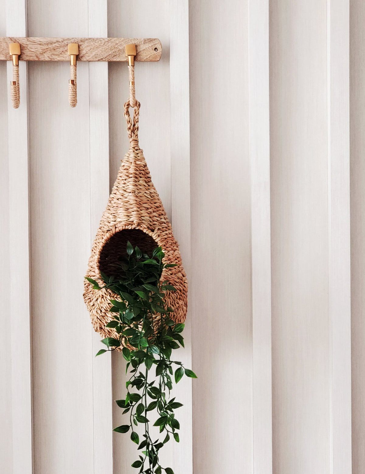 100% natural fiber - seagrass. sustainably handmade. Approximately  17.5" tall x 8.5" round. Teardrop shaped hanging planter.