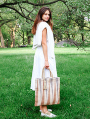 sustainably handmade reusable tote bag. Natural, Blue and Brown in color. Approximately 16”tall x 16"wide / Handle drop 7". 100% Handwoven Jute Fabric