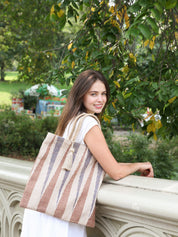 sustainably handmade reusable tote bag. Natural, Blue and Brown in color. Approximately 16”tall x 16"wide / Handle drop 7". 100% Handwoven Jute Fabric