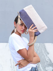  blue and white color block clutch handbag. 100% Handwoven Jute-Cotton Fabric. woven arm strap.small clutch. Approximately 8”tall x 13”wide x 2.25”deep. 100% Handwoven Jute-Cotton Fabric. sustainably handmade.