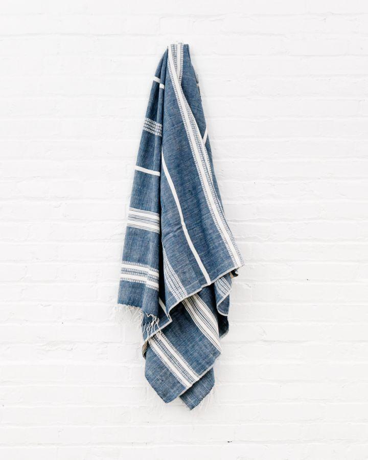 Bath Towel. Measures 38 x 72 inches. Machine wash and dry. ed as bath towels, lightweight shawls and accent throws. AZO-free dyes. hand-woven in Ethiopia. Navy with Natural. 