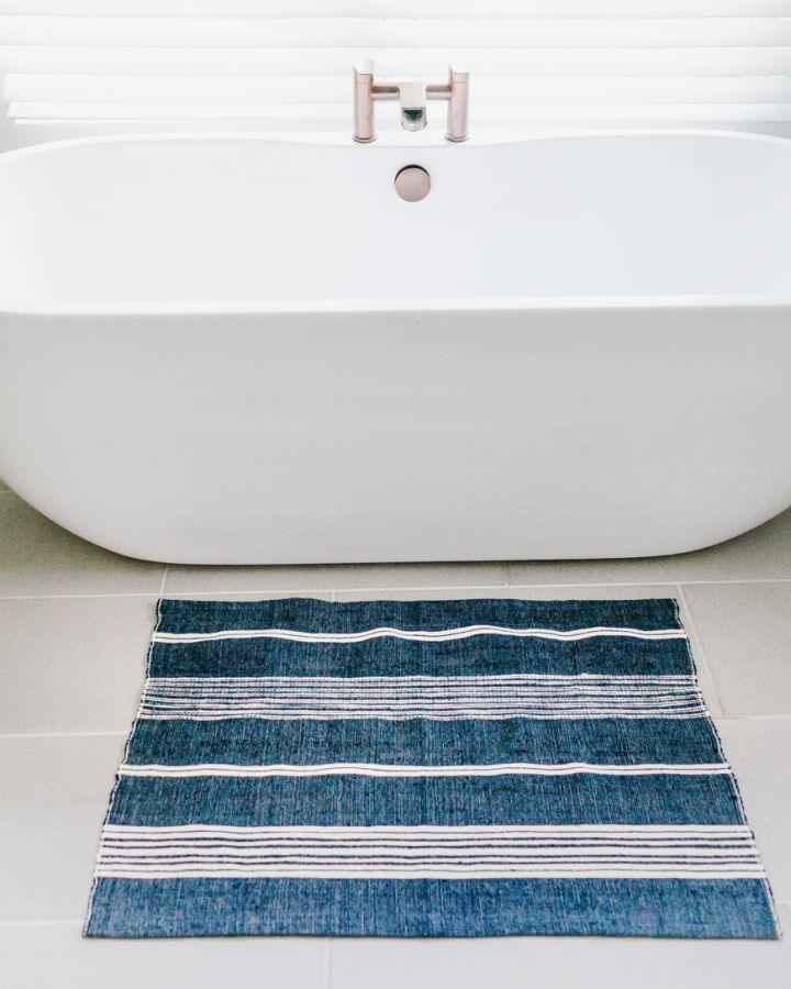 Aden Cotton Bath Mat. 24 x 36 inches.  Hand-spun Ethiopian cotton. woven from thick hand-spun cotton. navy with natural.